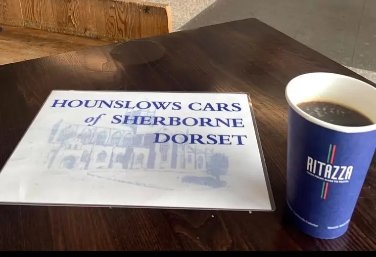 The Hounslows name board waiting at arrivals